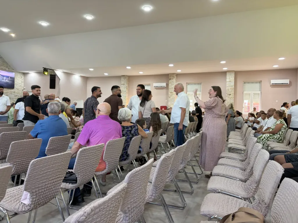 Members of Vitezda Church gathering for prayer and worship inside the new church building.