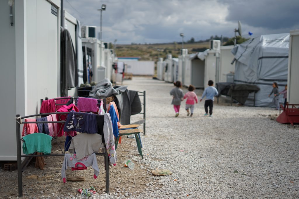 children walking in refugee camp