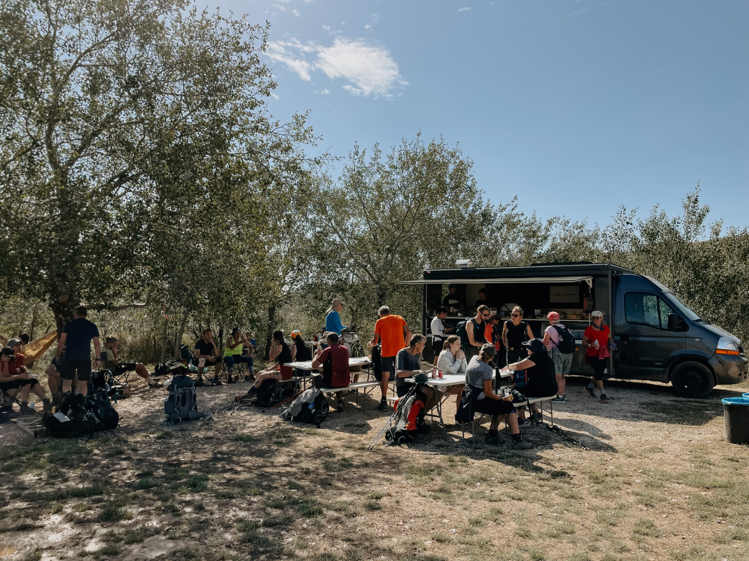 group gathering at food truck; spiritual nourishment along the Camino